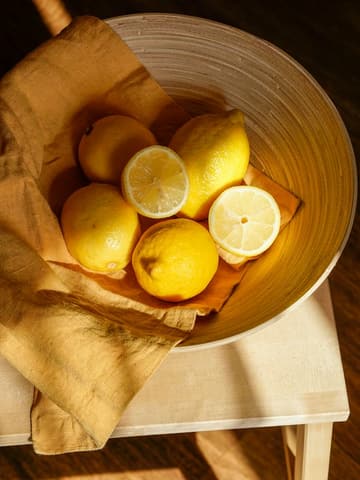 Lemons in a bowl, slightly out of focus